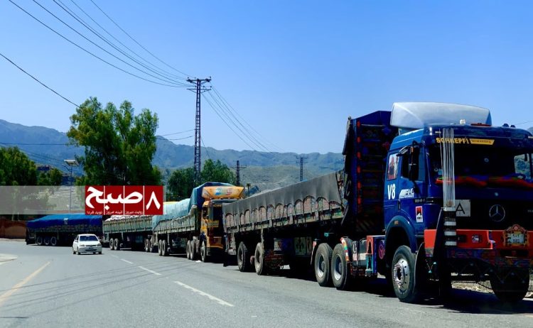 Cargo trucks wait at the Torkham border crossing as traders face heavy financial losses due to prolonged closures. Photo Credit: 8am