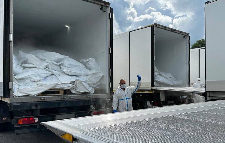Trucks loaded with Ukrainian war casualties (Photo Credit: TASS/RT)