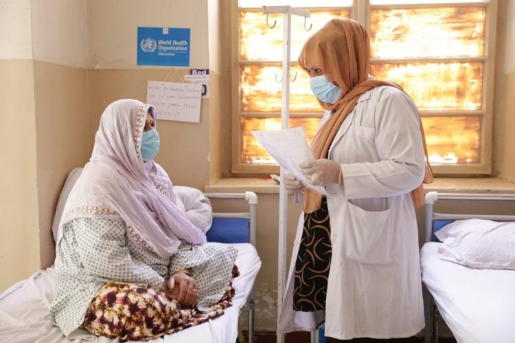 A female doctor consults with a patient at a WHO-supported health facility in Afghanistan, where access to healthcare for women remains under severe threat amid Taliban restrictions. (Photo Credit: WHO)