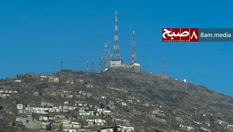 Telecommunications towers overlooking a residential area, reflecting widespread concerns over poor connectivity and high costs of communication services across the country. (Photo Credit: 8am.media)
