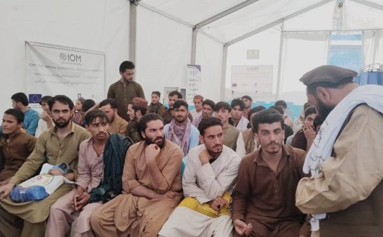 Afghan migrants who were recently released from Pakistani prisons are seen at an IOM First Arrival Humanitarian Assistance point at the Spin Boldak crossing, following their return to Afghanistan on March 12, 2025. (Photo Credit: @MoRRAfg)
