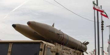 Iranian ballistic missiles mounted on military vehicles are displayed during a parade in Tehran, as Iran's IRGC claimed responsibility for a missile strike targeting Tel Aviv and Israel's Defense Ministry. (Photo Credit: Majid Saeedi/ Getty Images)