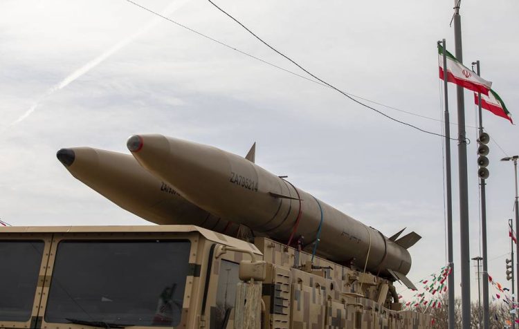 Iranian ballistic missiles mounted on military vehicles are displayed during a parade in Tehran, as Iran's IRGC claimed responsibility for a missile strike targeting Tel Aviv and Israel's Defense Ministry. (Photo Credit: Majid Saeedi/ Getty Images)