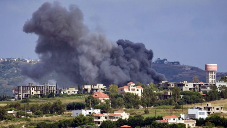 Thick smoke billows over a Lebanese village following Israeli airstrikes targeting Hezbollah positions in southern Lebanon. (Photo Credit: Getty Images)
