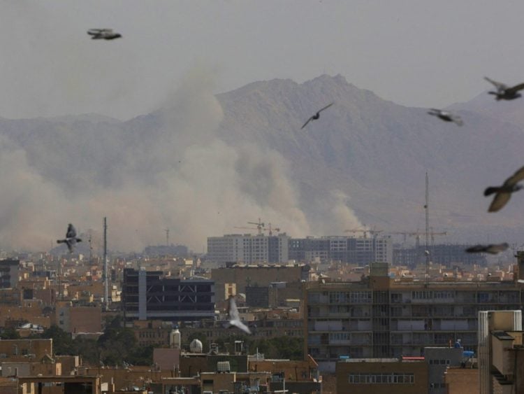 Tehran engulfed in smoke after bombing. Photo Credit: Reuters