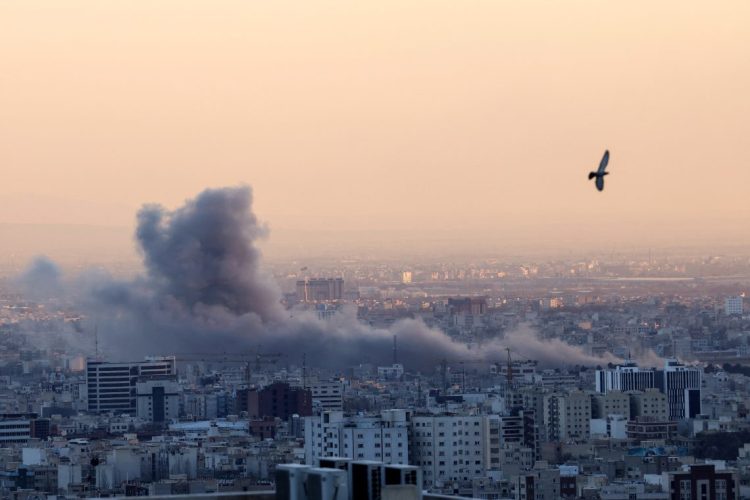 Smoke rises over Tehran following US military strikes on Iranian targets, as conflict escalates across the region. (Photo Credit: ATTA KENARE / AFP)