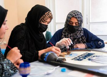 Women participate in a UNHCR-supported art activity, reflecting the resilience and creativity of displaced women in Afghanistan. (Photo Credit: UNHCR)