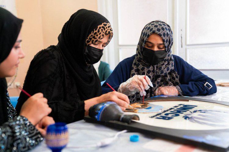 Women participate in a UNHCR-supported art activity, reflecting the resilience and creativity of displaced women in Afghanistan. (Photo Credit: UNHCR)