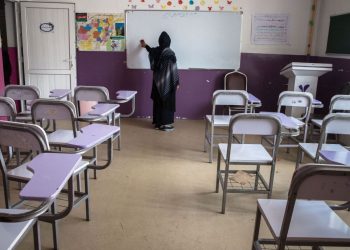 A female teacher cleans a classroom in a girls’ school as female educators in Jawzjan report dismissals, discrimination, and increasing pressure by the Taliban. (Photo Credit: ISOPIX)