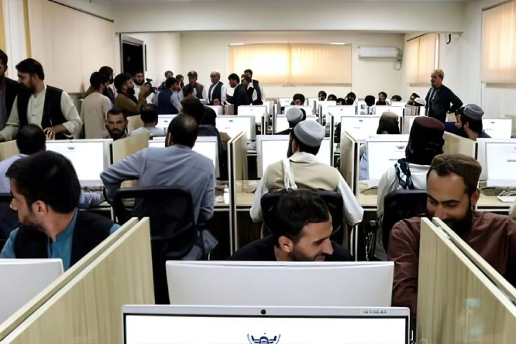 Men working at computer workstations inside a government office in Afghanistan. (Photo Credit: Social Media)