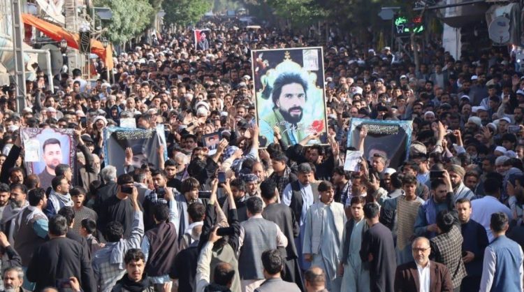 Large crowd carries victims’ photos during Herat protest (Photo Credit: Social Media)