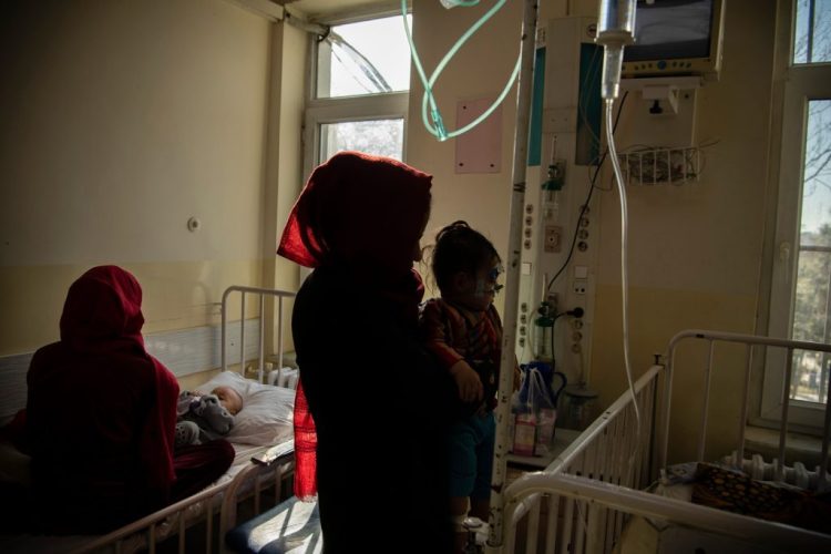 Women and a child receiving care in a hospital, highlighting malaria’s impact on families in Afghanistan. (Photo Credit: WHO Afghanistan)