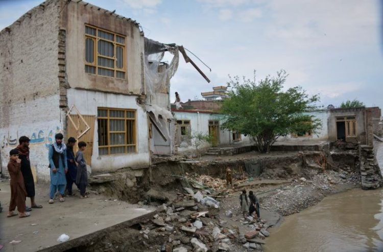 Damaged house by river after roof collapse in Afghanistan (Photo Credit: AP)