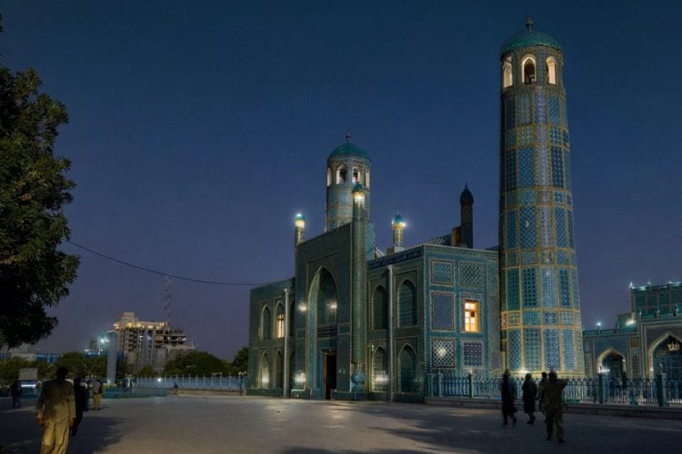 The shrine of Hazrat Ali in Mazar-i-Sharif, Balkh Province, Afghanistan, illuminated at dusk. (Photo Credit: Pexels)