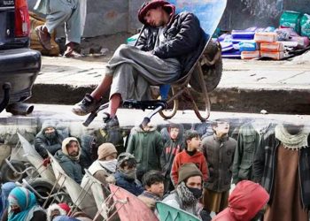 Young laborers waiting beside streets with wheel carts. (Photo Credit: Social Media + Reuters)