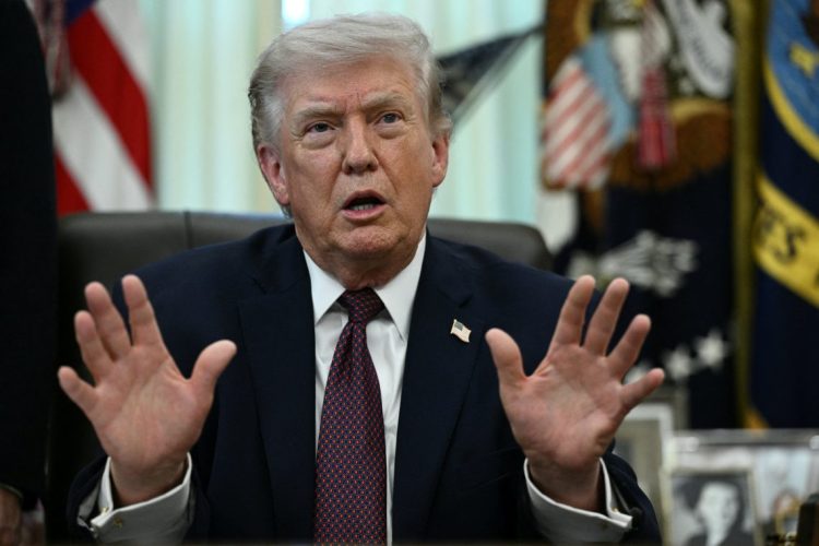 Donald Trump speaking with hands raised (Photo Credit: BRENDAN SMIALOWSKI / AFP)