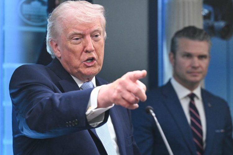 Trump speaking and pointing during a public address (Photo Credit: SAUL LOEB / AFP)