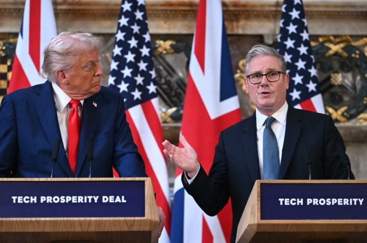 Trump and Starmer speaking on stage before a podium discussing maritime security and shipping routes. (Photo Credit: ANDREW CABALLERO-REYNOLDS / AFP)