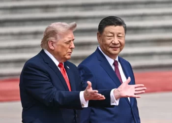 U.S. President Donald Trump and Chinese President Xi Jinping speak during a meeting in Beijing. (Photo credit: Bloomberg)