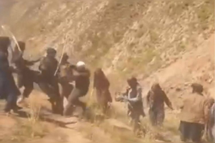 Taliban fighters seen in a video beating two elderly men, an incident condemned by human rights activists who say it reflects systematic violence. (Photo credit: HRAUnion@)