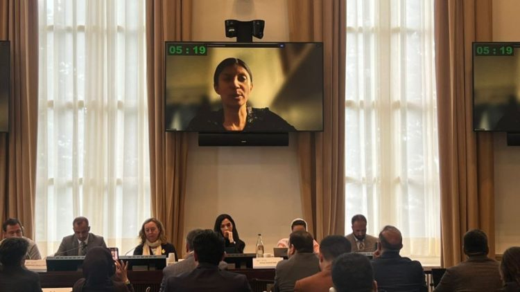 Participants attend a Geneva conference on transitional justice and the rule of law in Afghanistan as Shahrzad Akbar addresses the gathering virtually. (Photo credit: Exclusive)