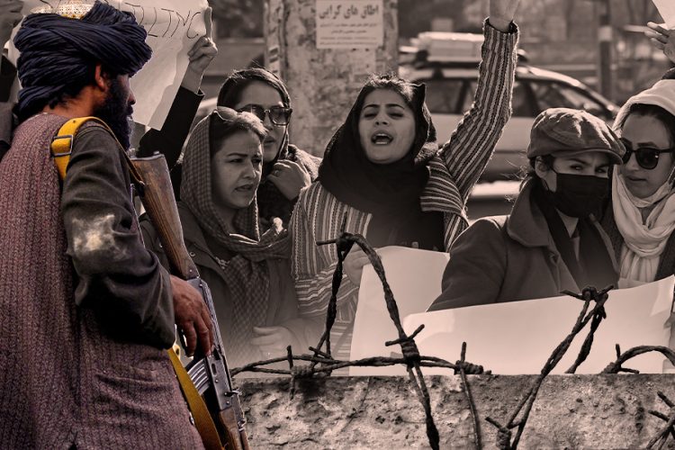 An armed Taliban fighter stands behind barbed wire as women protesters raise their voices against Taliban restrictions in Kabul. (Photo Credit: AFP)