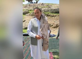 A victim stands in a village setting after being targeted in Nangarhar province amid rising insecurity and violent incidents. (Photo credit: Exclusive)