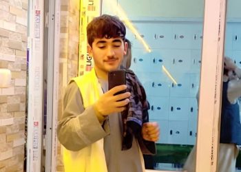 A photo of the 19-year-old man who drowned in Faryab, showing him taking a selfie in front of a mirror with his mobile phone. (Photo credit: Exclusive)