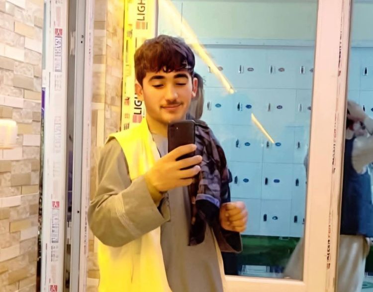 A photo of the 19-year-old man who drowned in Faryab, showing him taking a selfie in front of a mirror with his mobile phone. (Photo credit: Exclusive)