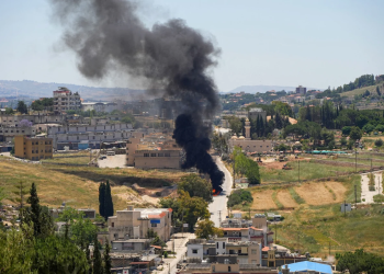 Fire and smoke rise following an airstrike, indicating the aftermath of a military attack. (Poto credit: Reuters)