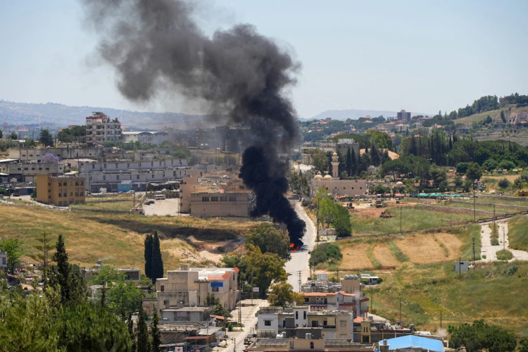 Fire and smoke rise following an airstrike, indicating the aftermath of a military attack. (Poto credit: Reuters)