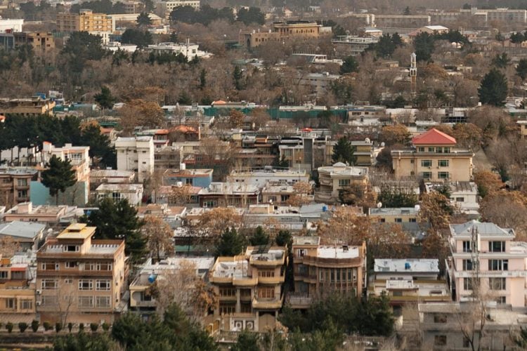 A dense residential neighborhood of Kabul is seen from above, where brokers say Taliban restrictions have stalled real estate transactions. (Photo credit: Pexels)