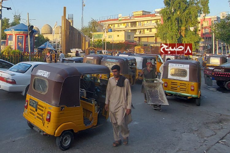 Rickshaw drivers and their vehicles crowd a busy street in Nangarhar as the Taliban's sweeping ban threatens to strip thousands of their only source of livelihood. (Photo credit: 8am.media)