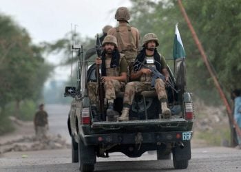 Pakistani soldiers ride in a military vehicle during a security operation near the country’s border region (Photo: Getty Images)
