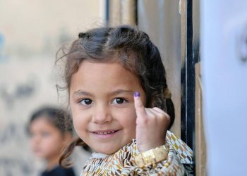 A child shows their marked finger after receiving a vaccination. (Photo: UNICEF)