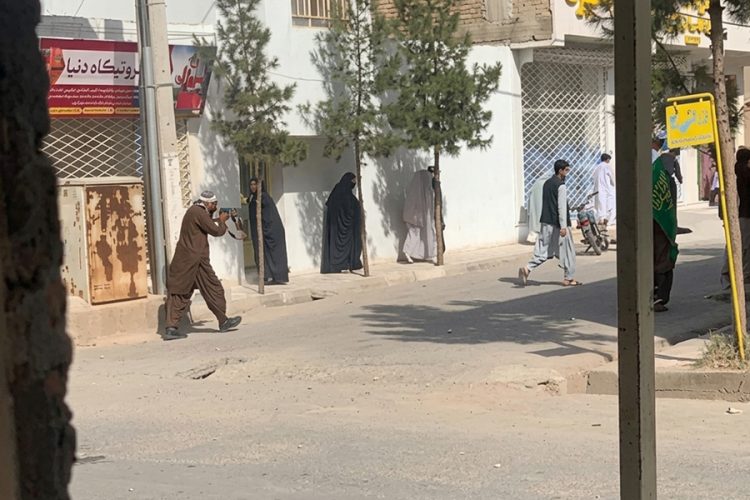 A Talib fires at women protesters in the Jibril district of Herat as demonstrations against Taliban detentions erupt in the streets. (Photo credit: Social media)
