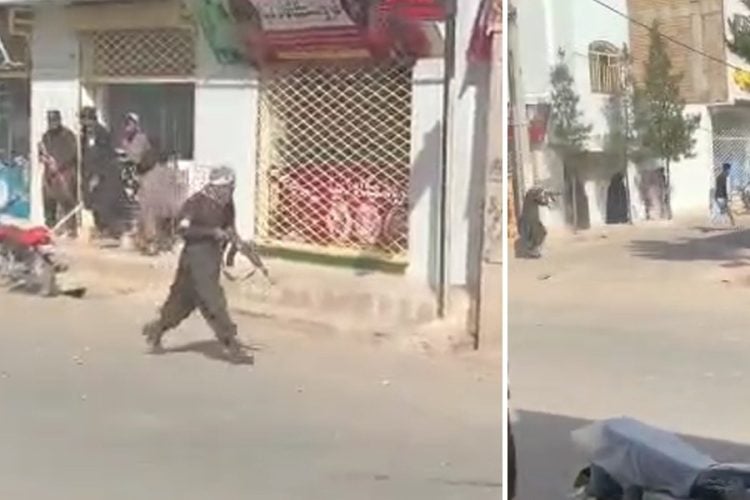 Armed Taliban fighters move through a street in Herat as they open fire on protesters demonstrating against the detention of women and girls. (Photo credit: social media)