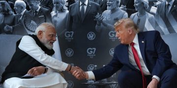 Indian Prime Minister Narendra Modi and U.S. President Donald Trump shake hands during a bilateral meeting on the sidelines of the G7 summit in France, as world leaders gathered in the background. (Photo Credit: AP)