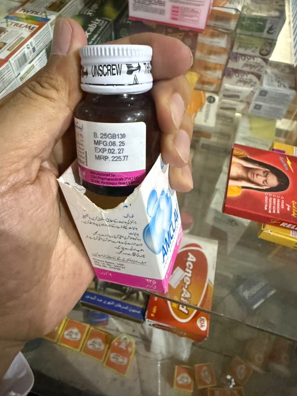 A bottle of Amclav syrup, manufactured by a Pakistani pharmaceutical company, is displayed at a pharmacy counter in Kabul. (Photo credit: Exclusive)