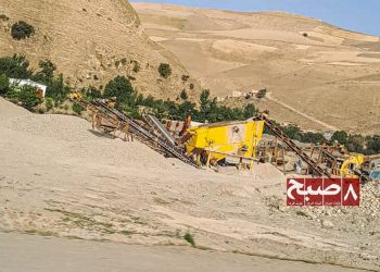 Heavy machinery processes gravel at a gold mining site in Badakhshan province, where farmland is increasingly sold or seized for mineral extraction. (Photo credit: 8am.media)