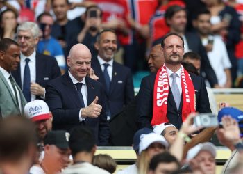 FIFA President Gianni Infantino attends a football event alongside Norwegian Football Federation President Lise Klaveness, with fans gathered in the stands (Photo: PATRICIA DE MELO MOREIRA / AFP)