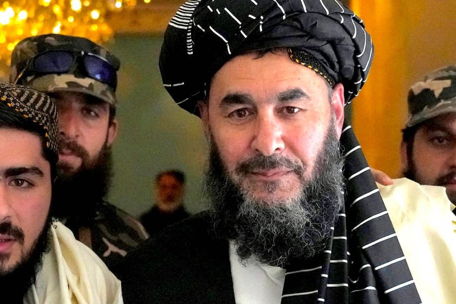 Haji Bashir Noorzai, surrounded by armed guards, is seen at a gathering. (Photo credit: Wikipedia)