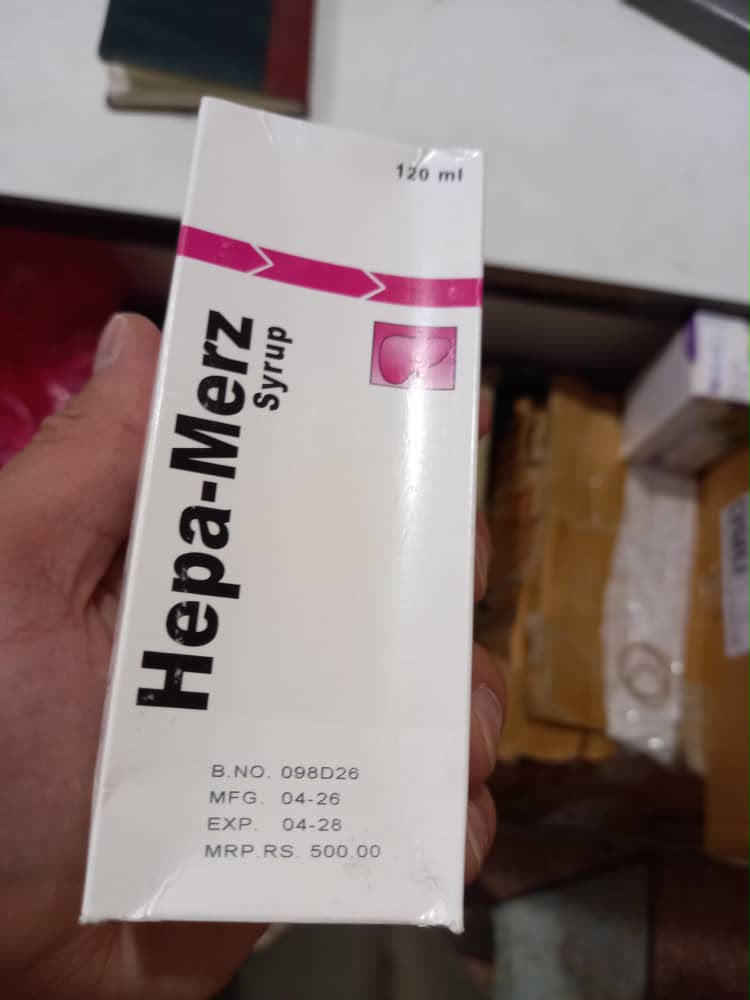 A 120ml box of Hepa-Merz Syrup, manufactured in April 2026, is held up showing its batch and expiry details. (Photo credit: Exclusive)