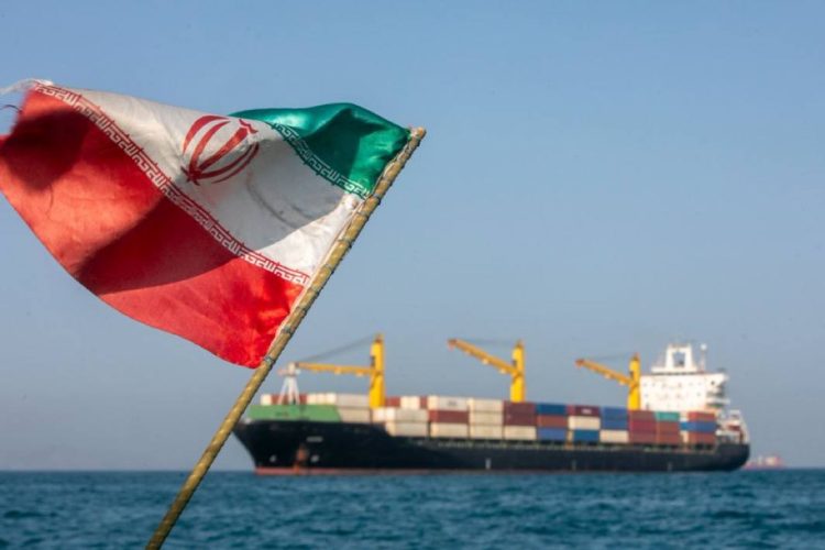Iran’s flag is seen with a ship in the background amid reports of a US attack on Larak Island in the Strait of Hormuz. (Photo credit: Fox News)