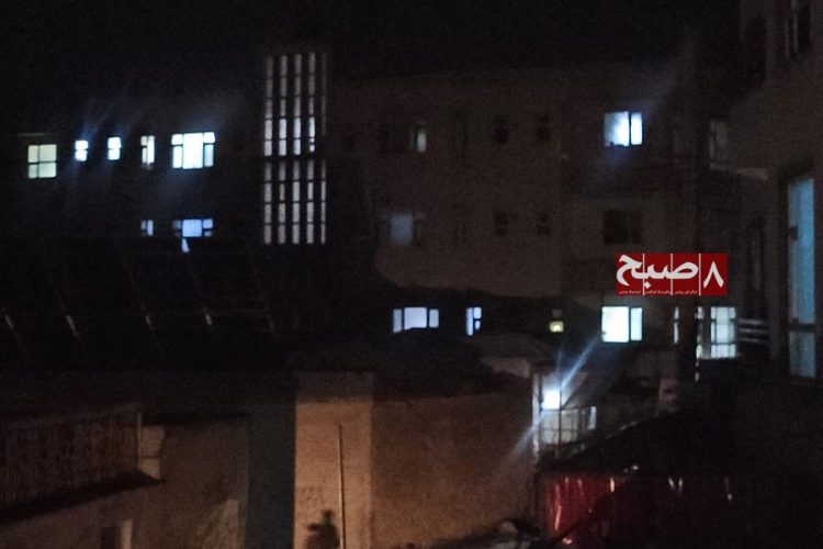 Buildings stand partially lit at night in Kabul as prolonged power outages continue amid a summer surge in seasonal illnesses. (Photo credit: 8am.media)