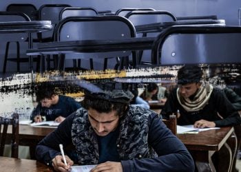 Male candidates sit for the Kankor university entrance exam in a classroom, as girls remain barred from taking part under Taliban restrictions. (Photo credit: AFP)