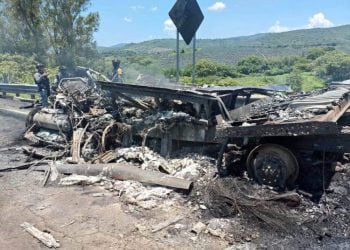 A heavily damaged vehicle sits on the side of a highway following a fatal traffic crash in Jalisco state, Mexico, that killed nine people and injured 10 others (Photo: AFP)