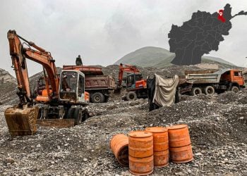Excavators and trucks dig through gravel at a gold mining site in Takhar province, with a map marking the region. (Photo credit: social media)