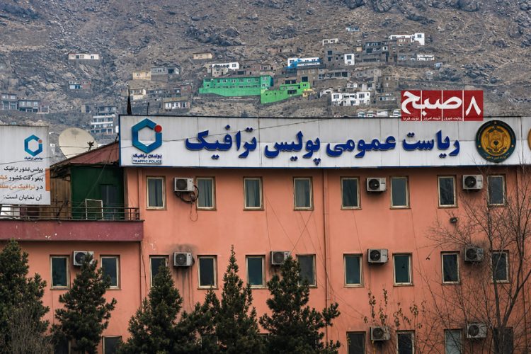 The Traffic Police headquarters building stands beneath a hillside neighborhood in Kabul, amid reports of widespread bribery within the department. (Photo credit: 8am.media)