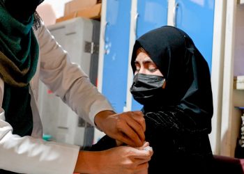 In the image, a teenage girl is seen as a health worker administering a vaccine to her. (Photo Credit: UNICEF/X)